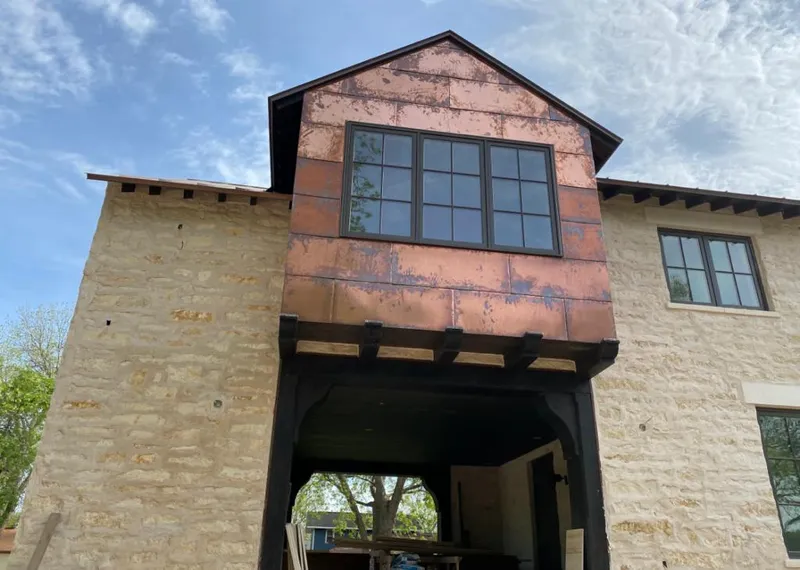 Copper metal panel facade on a stone building for Metal Roof Coating in Carver